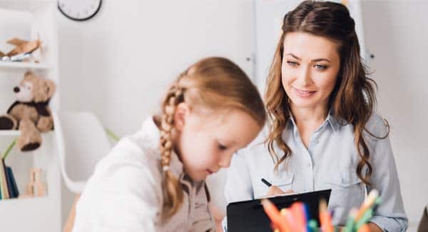 Volunteer helping student