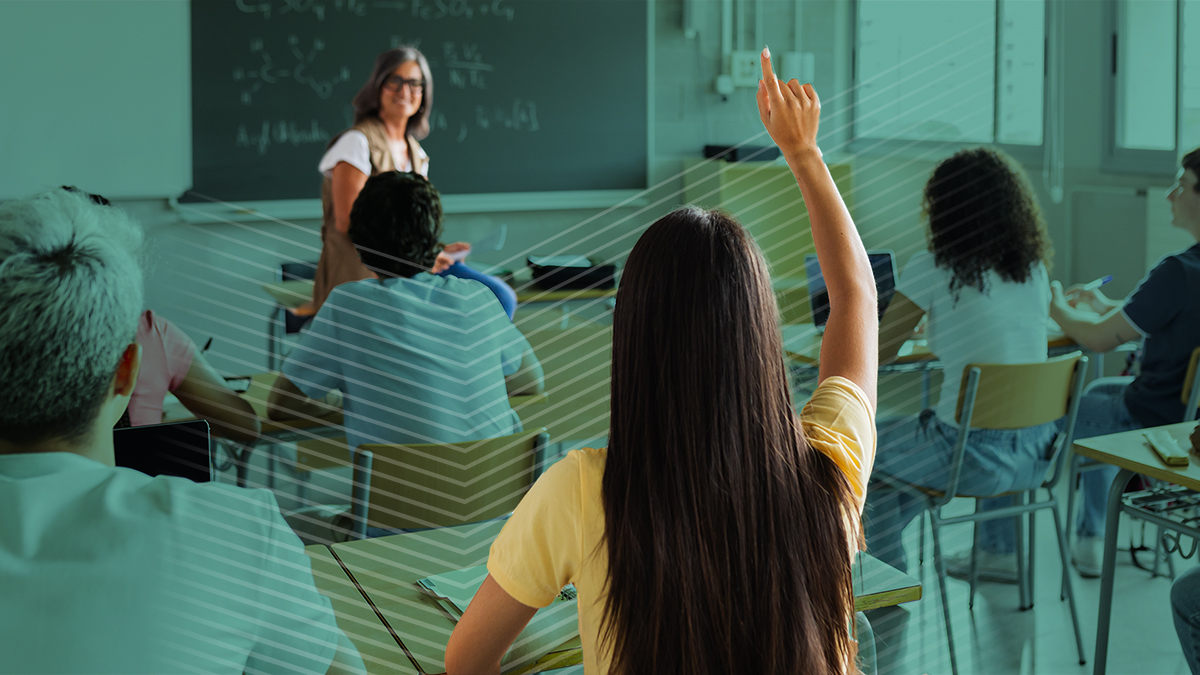 a student raising her hand in class to use a digital hall pass