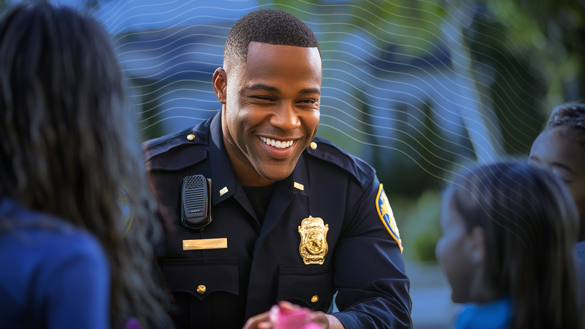 A Black School Resource Officer SRO is building trusted relationship with elementary students