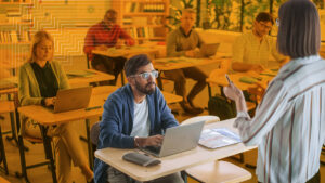 A school administrator doing violence prevention training in a classroom of teachers