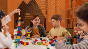 A daycare teacher keeps her children calm during emergency prepardness