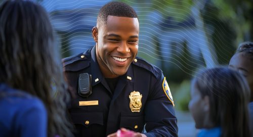 A Black School Resource Officer SRO is building trusted relationship with elementary students