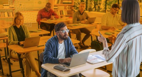 A school administrator doing violence prevention training in a classroom of teachers