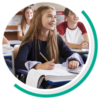 Group of students in a classroom listening attentively